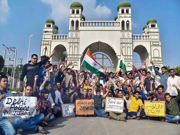 Students hold placards as they raise slogans during a protest against Citizenship Amendment Act (CAA) and National Register of Citizens (NRC) at Maulana Azad National Urdu University in Hyderabad. (Image: PTI)