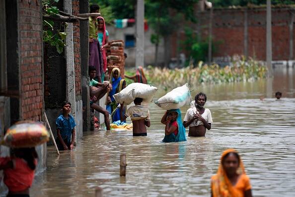 The 2019 Bihar floods affected 13 districts of North Bihar, India, causing 130 deaths by the end of July. 1269 panchayats (settlement councils) under 92 blocks of 13 districts of Northern Bihar were severely affected in the flood. Around 88.46 lakhs (8.846 million) people were affected. (Getty Images)