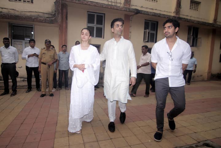 Karan Johar with Alia Bhatt & Ayan Mukerji pay last respects to Ritu Nanda. (Photo Credit: Getty Images)