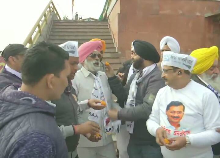 Aam Aadmi Party workers in Amritsar, Punjab too celebrated with distribution of sweets as trends indicate lead for the party. (Photo Credit: ANI)