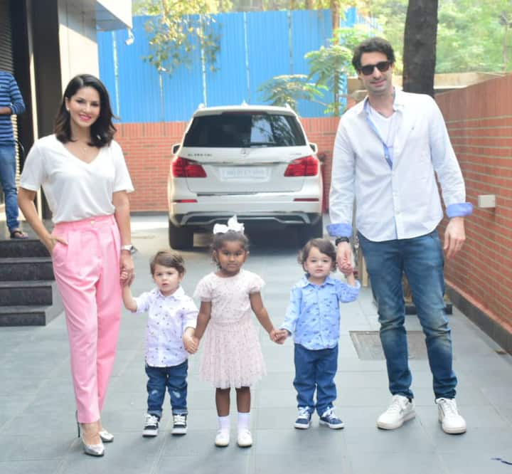 While Sunny Leone looked stunning in white top & pink pants, her husband Daniel looked dapper in casuals. (Photo: Manav Manglani)