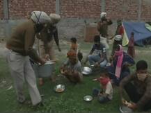 IN PICS: Police Personnel Distribute Food Among Needy People Amid Lockdown