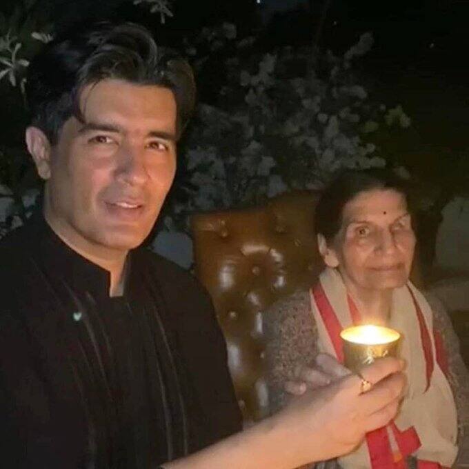 Designer Manish Malhotra lights a candle with his mother. (Image Source: Instagram)