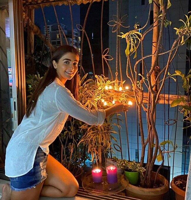 Pooja Hedge lights diyas to express support & solidarity. (Image Source: Instagram)