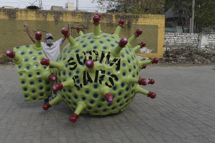 He says that it took nearly ten days to design and develop the car. The one of a kind car will now go around the roads of Hyderabad to spread awareness about the virus, how one gets infected by it and the importance of staying indoors.(Photo by NOAH SEELAM / AFP)