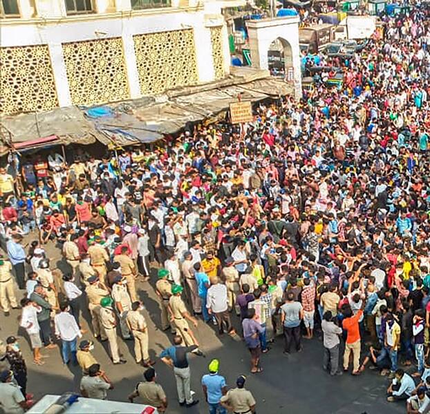 Mumbai: Migrant workers gather outside Bandra West Railway Station as they defy lockdown norms and request to leave for their native places after Prime Minister Narendra Modi had announced the extension of nationwide lockdown. (PTI Photo)