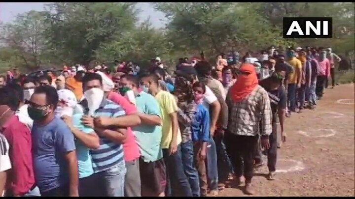Chhattisgarh: Social distancing norms were flouted as people in large numbers queue outside a liquor shop in Rajnandgaon. (Photo: ANI)
