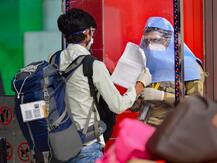 IN PICS| Face Masks, Thermal Checks & PPE Suits: How Airports Across India Are Upholding Safety Norms As Flights Resume