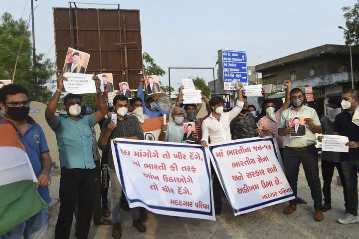 Members of the non-governmental organisation MADADGAAR PARIVAR, hold placards and shout slogans as they protest against the killing of three Indian soldiers by Chinese troops, in Ahmedabad on June 16. (Image: SAM PANTHAKY / AFP)