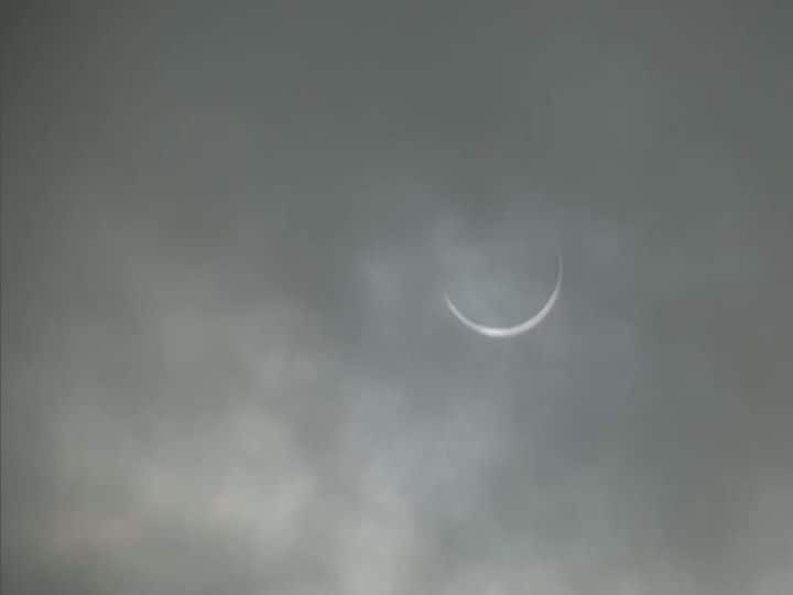 The national capital gets a glimpse of annular solar eclipse amid the dark cloudy skies. (Image: ANI)