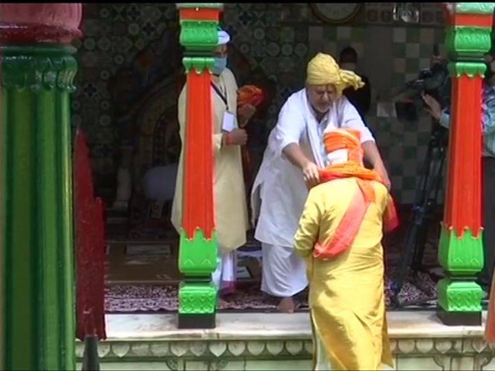 Prime Minister Narendra Modi presented with a headgear, silver 'mukut' and stole by Sri Gaddinsheen Premdas Maharaj, head priest of 10th-century Hanuman Garhi Temple.