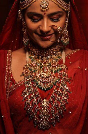 She chose to wear a red bridal lehanga on her big day, the actress completed her look with heavy jewelry. 