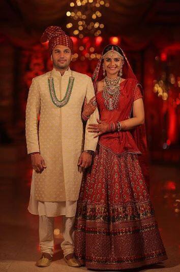 Her husband Rohit Saroh complemented her in a cream sherwani.