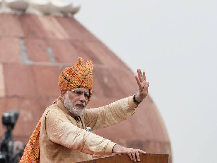 IN 2015, This year, along with a checkered mustard-yellow turban with hints of red, green and pink, Modi sported a tricolour pocket square. His outfit was a variation of beige on beige, or muted mustard, perhaps a dull gold. (Getty Images)
