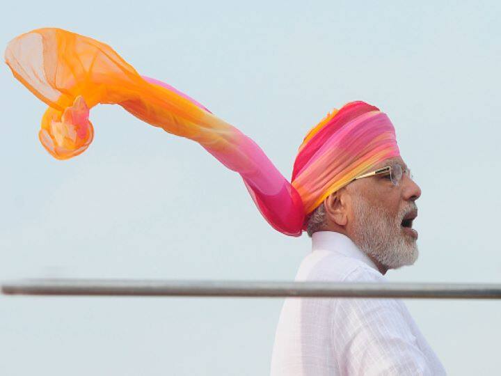 IN 2016: PM Modi, for his third address from the Red Fort, came dressed in white half-sleeve kurta and chudidaar paijama.His outfit was plain but he flattered the look by wearing a red, pink and yellow colored Rajasthani safa. This time the length of the safa was till his kurta, much longer than the ones he wore for the last two times.The black jutti complimented his look pretty well. (Getty Images)