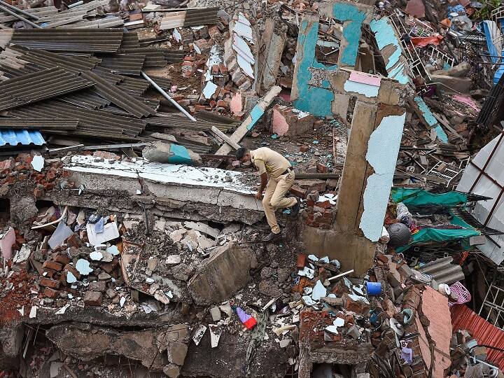Raigad: A rescue personnel searches for survivors at the site of a five-storey building collapse, in Mahad in Raigad district, Tuesday, Aug. 25, 2020. The incident took place on Monday night. (PTI Photo/Kunal Patil) (PTI25-08-2020_000053B)