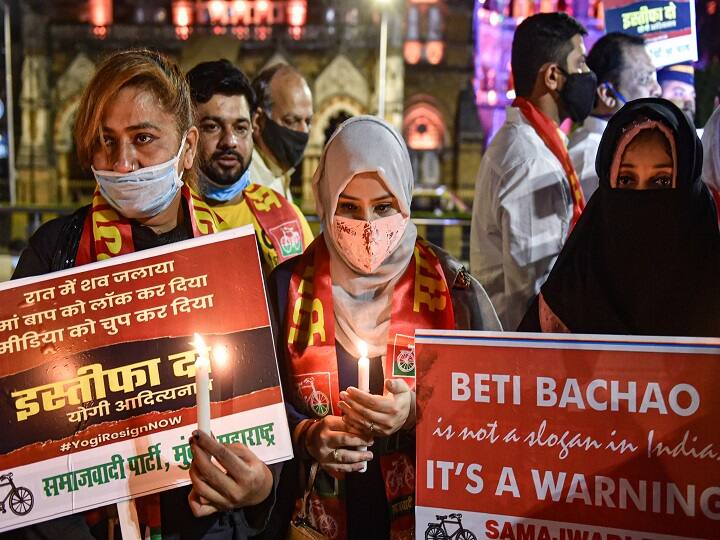 Mumbai: Activists hold placards and light candles demanding justice for the Hathras gang-rape victim, outside CST, in Mumbai, Wednesday, Sept. 30, 2020. (PTI Photo/Mitesh Bhuvad)
(PTI30-09-2020_000258B)