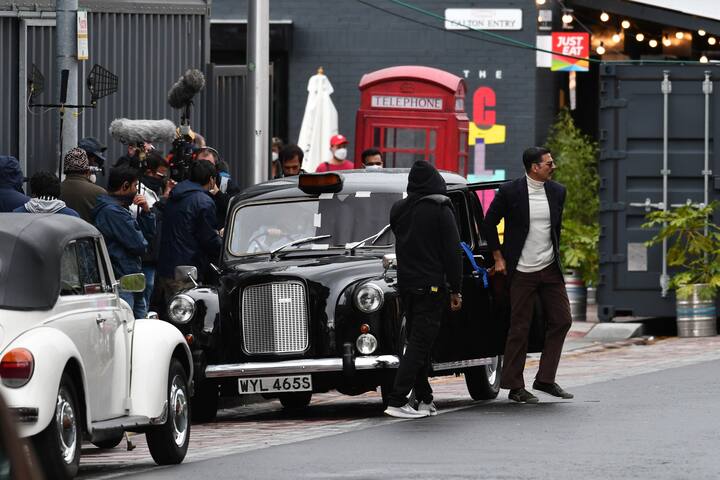 While in one he is seen wearing a pullover, paired with a dark blue blazer and, and a pair of corduroy pants.