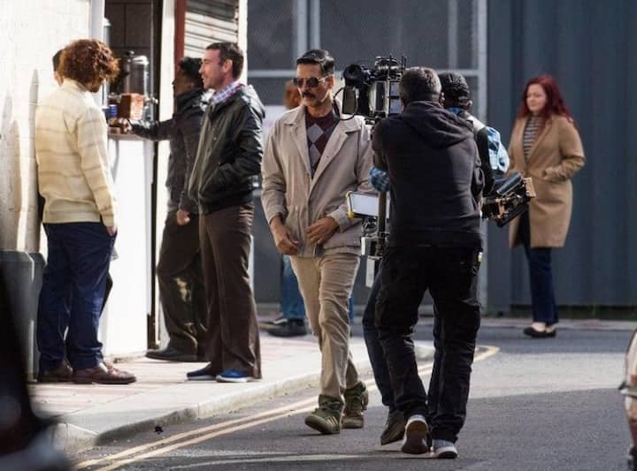 In another pic, he is seen dressed in a black and grey sweater, paired with a grey denim jacket and jeans with ’80s style sneakers.