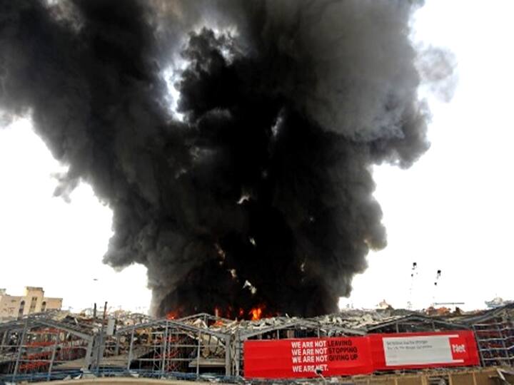 Thick black columns of smoke rose into the sky, as the army said the fire had engulfed a warehouse storing engine oil and vehicle tyres. (Photo by ANWAR AMRO / AFP)