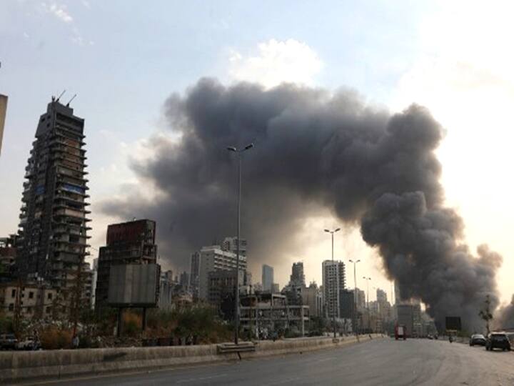 A general view shows smoke billowing from a huge fire that raged in Beirut's port on September 10, 2020, sending a column of black smoke into the sky and sparking alarm among Lebanese still reeling from the devastating dockside blast last month. (Photo by ANWAR AMRO / AFP)