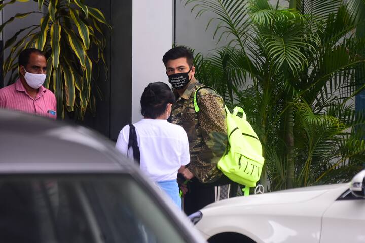 Bollywood filmmaker Karan Johar was snapped outside the Mumbai airport on Tuesday (September 15). He was accompanied by his two kids Yash and Roohi and mother Hiroo Johar. 