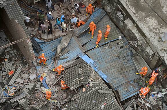 National Disaster Response Force (NDRF) carry out rescue operation after a three-storeyed building collapsed, at Bhiwandi in Thane district, Monday, Sept. 21, 2020. (PTI Photo/Mitesh Bhuvad)(PTI21-09-2020_000051B)