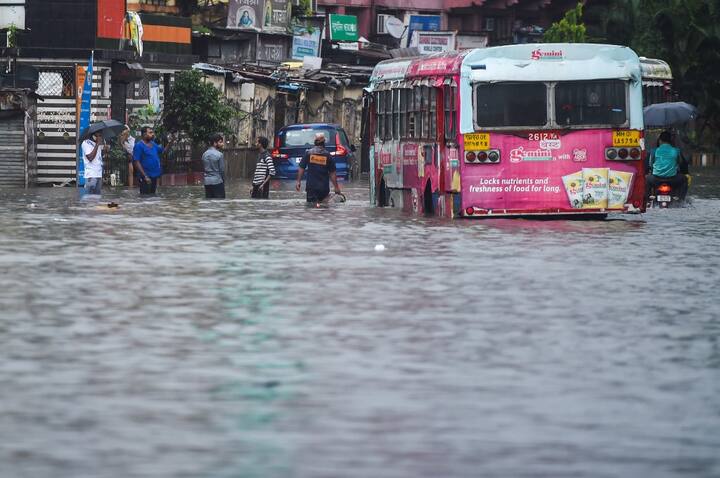 The IMD Mumbai has forecast another wet day with heavy rain as the civic authorities urged people to avoid stepping out unless necessary. Heavy water-logging was reported from the traditional flood-prone areas of central Mumbai like Sion, Matunga, Kurla, Chunabhatti, Mazagaon, Masjid Bunder and Byculla. Besides several areas in the suburbs like Goregaon, Malad, Dahisar, Kurla, Ghatkopar, Mulund experienced waterlogging. (Image: AFP)