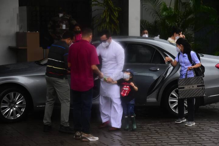 Saif was wearing a white kurta-pyjama set, Taimur was wearing a black T-shirt, denim and boots. 