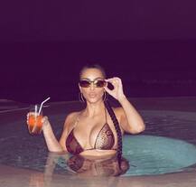 PHOTOS: Amidst Divorce News Kim Kardashian Poses In Snakeskin-Print Bikini For 'Night Swim'