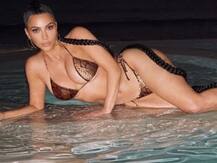 PHOTOS: Amidst Divorce News Kim Kardashian Poses In Snakeskin-Print Bikini For 'Night Swim'