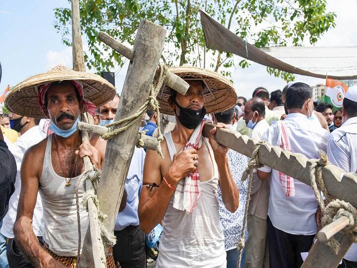 Guwahati: Farmers and activists of  Assam Pradesh Congress Committee (APCC) carry traditional ploughing instruments during a protest against the passing of recent farmers bill 2020, in Guwahati, Monday, Sept. 28, 2020. (PTI Photo)(PTI28-09-2020_000055B)