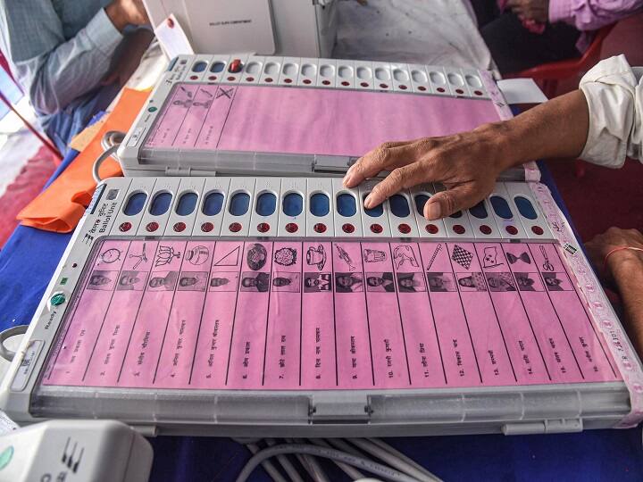 Patna: Electronic Voting Machine (EVM) sealing officers check EVMs and Voter-Verified Paper Audit Trail (VVPATs) ahead of the second phase of Bihar assembly polls, in Patna. (Image: PTI)