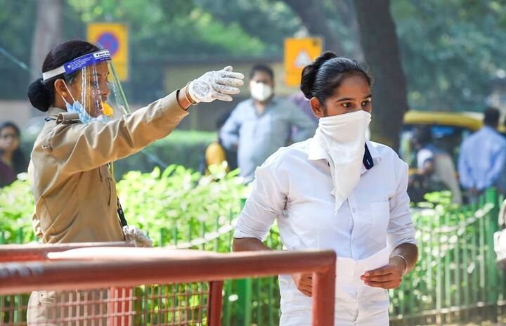 New Delhi: A candidate seeks directions from a security person as she arrives at an examination centre to appear in the Union Public Service Commission (UPSC) prelims exam 2020, in New Delhi, Sunday, Oct. 4, 2020. (PTI Photo/Atul Yadav)