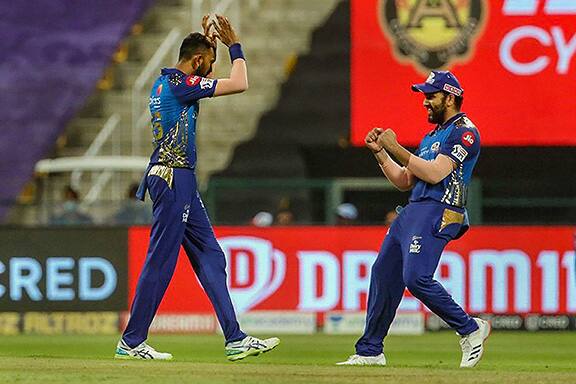Mumbai Indians players Krunal Pandy and Rohit Sharma celebrate the wicket of Kings XI Punjab batsman Karun Nair during the Indian Premier League 2020 cricket match. team Captain Rohit Sharma scored the most runs for Mumbai Indians in the 13th match of the IPL 2020. Image (PTI)