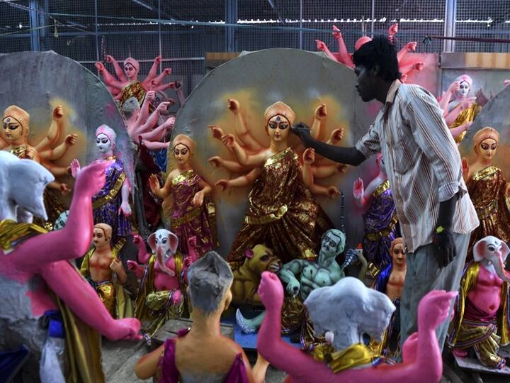 An artisan paints a clay sculpture depicting the Hindu goddess Durga ahead of 'Durga Puja' festival, in Chennai. Arun SANKAR / AFP