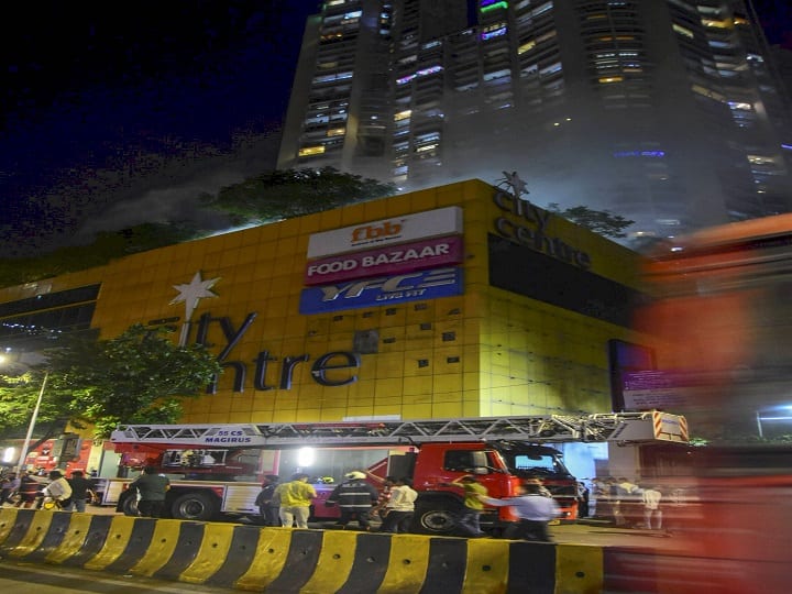 The fire flames can be seen from far away. At present, the shops around the mall have been evacuated. (PTI Photo)