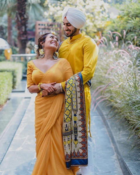 FIRST PICS: Neha Kakkar Twins With Beau Rohanpreet Singh During Their Haldi Ceremony, Looks Stunning In Yellow Saree