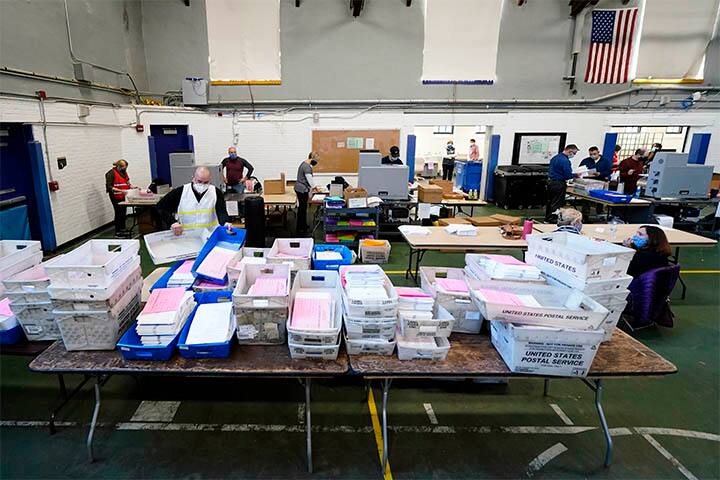 Chester County, Pa., election workers scan mail-in and absentee ballots.  Image (PTI)