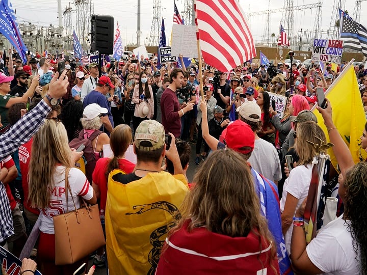 Phoenix: Charlie Kirk, center, conservative activist and founder of Turning Point USA, speaks to supporters of President Donald Trump at a rally outside the Maricopa County Recorder's Office Friday, Nov. 6, 2020, in Phoenix. AP/PTI(AP06-11-2020_000258A)