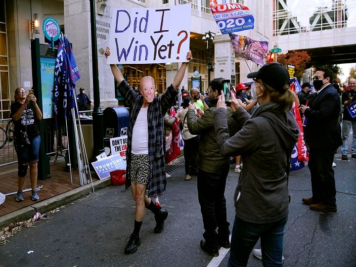 Philadelphia:A supporter of President Donald Trump wears a mask made from a photograph of Vice President Joe Biden outside the Pennsylvania Convention Center where votes are being counted, Thursday, Nov. 5, 2020, in Philadelphia, following Tuesday's electionAP/PTI Photo(AP06-11-2020_000018B)