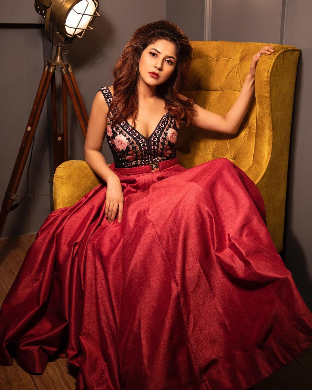 Shehnaaz Gill Looks Like A Red Hot Patakha Donning A Plunging Neckline Gown  With Impossible-To-Miss Puffed Sleeves & A Wild Vision To Behold!
