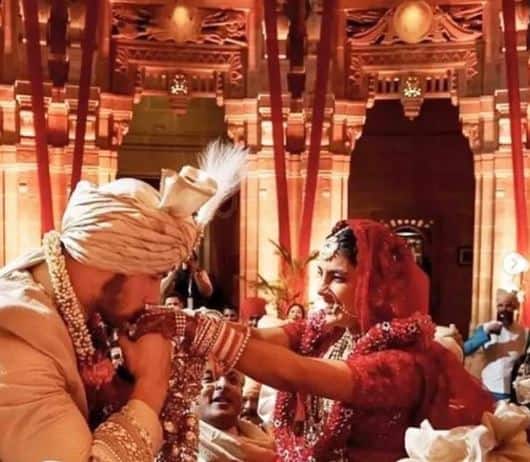While one of the pictures captured the then newly married couple embracing as Nick is seen kissing Priyanka's hands, the other one captures the royal attire of the husband-wife duo.