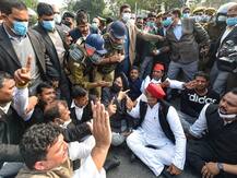 IN PICS: Cops Detain Akhilesh Yadav, Other Samajwadi Party Leaders As They Sit On Dharna On Road