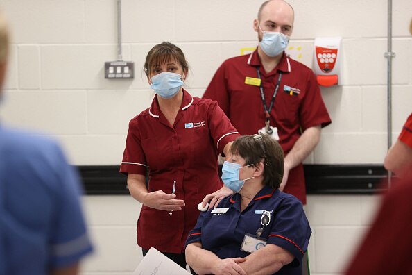 Clinical educator Sister, Lisa McCulloch (left) speaks to medical staff ahead of the delivery of the first Pfizer/BioNTech Covid-19 vaccine jabs in Northern Ireland at the Royal Victoria Hospital on the first day of the largest immunisation programme in the UK's history on December 8, 2020 in Belfast, Northern Ireland. (Image: PTI)