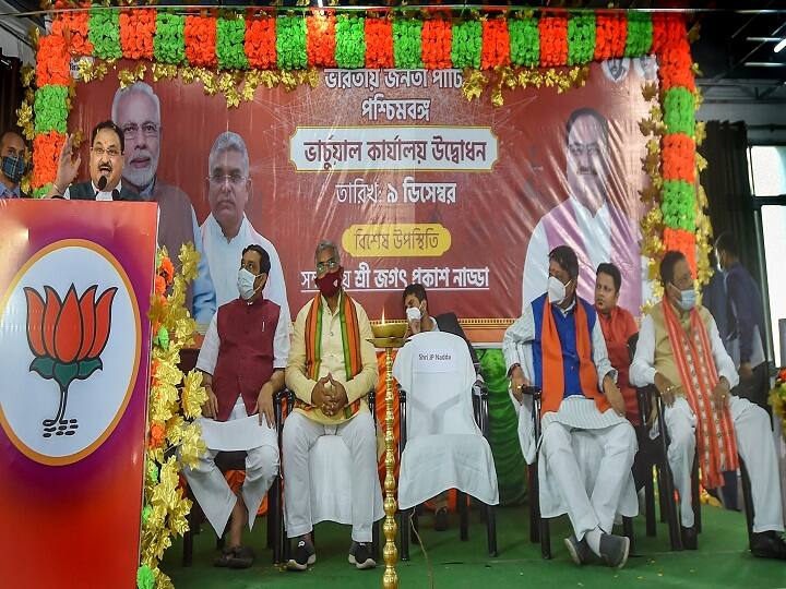 Party MPs Locket Chatterjee and Arjun Singh accompanied Nadda as his security tried to hold back the crowd when his vehicle negotiated the narrow lane to take him to some of the houses in it. (Image: PTI)