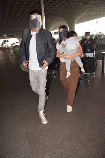 These Pics Of Arjun Rampal & Girlfriend Gabriella Holding Their Sleeping Baby Son At Airport Is Just Too Awwdorable!