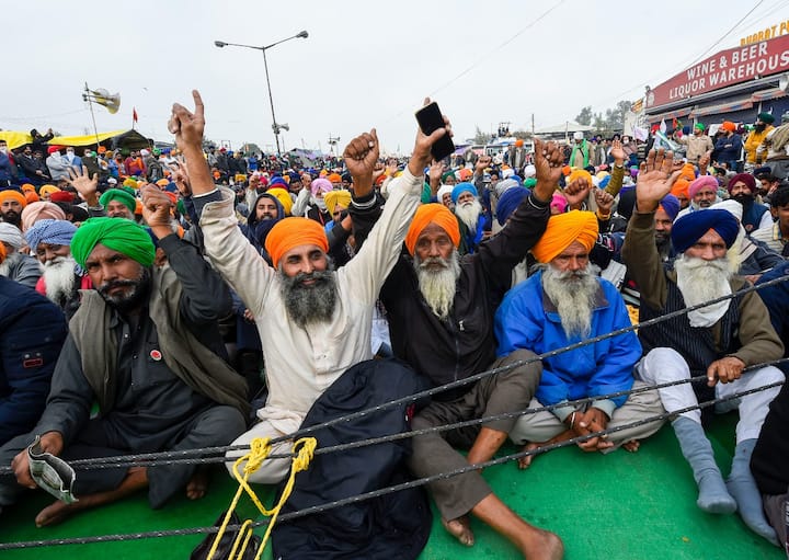 The farmers protest against the three farm laws enacted by the Central government earlier this year, continues to intensify as the protesters dig in for the 18th straight day on Sunday, December 13. (Image Source: PTI)