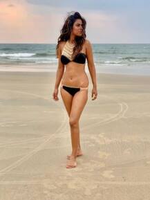 IN PICS: Nia Sharma Sets Internet On Fire Posing In A Tiny Black Bikini In Goa!