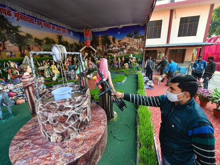 A local administration staff member inspects Cathedral Church premises on the eve of Christmas festival, in Lucknow. (Image: PTI)